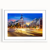 Abstract art print of Madrid skyline in muted gray and blue tones, framed with a white mat, ideal for dining room decor.