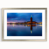 Textured art of abstract Stockholm scenery in muted gray and blue tones, framed with a silver mat.