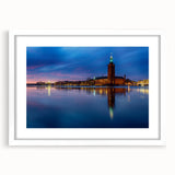 Abstract art print of Stockholm scenery in muted blue and gray tones on a white framed canvas.