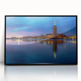 Large abstract wall art depicting the Stockholm skyline in muted gray and blue tones on a framed acrylic.