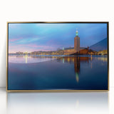 Large art print of Stockholm scenery in muted gold and blue tones on framed acrylic, suitable for modern nursery decor.