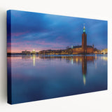 Side view of a large, stretched canvas depicting a serene Stockholm cityscape in soft blue and gray tones.