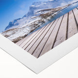 Art deco poster featuring a serene Swiss landscape, rendered in soft blues and greens on rolled canvas.