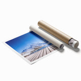 Extra large rolled print of a Swiss landscape with vibrant green fields and distant mountains.