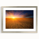 Textured abstract art print of a serene European landscape in muted earth tones, framed in silver, ideal for bedroom art.