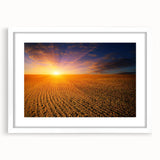 Abstract art print of a European landscape in muted blues and greens, framed with a white mat.