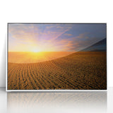 Acrylic print of a serene European landscape, with muted blue and green tones, framed in white.