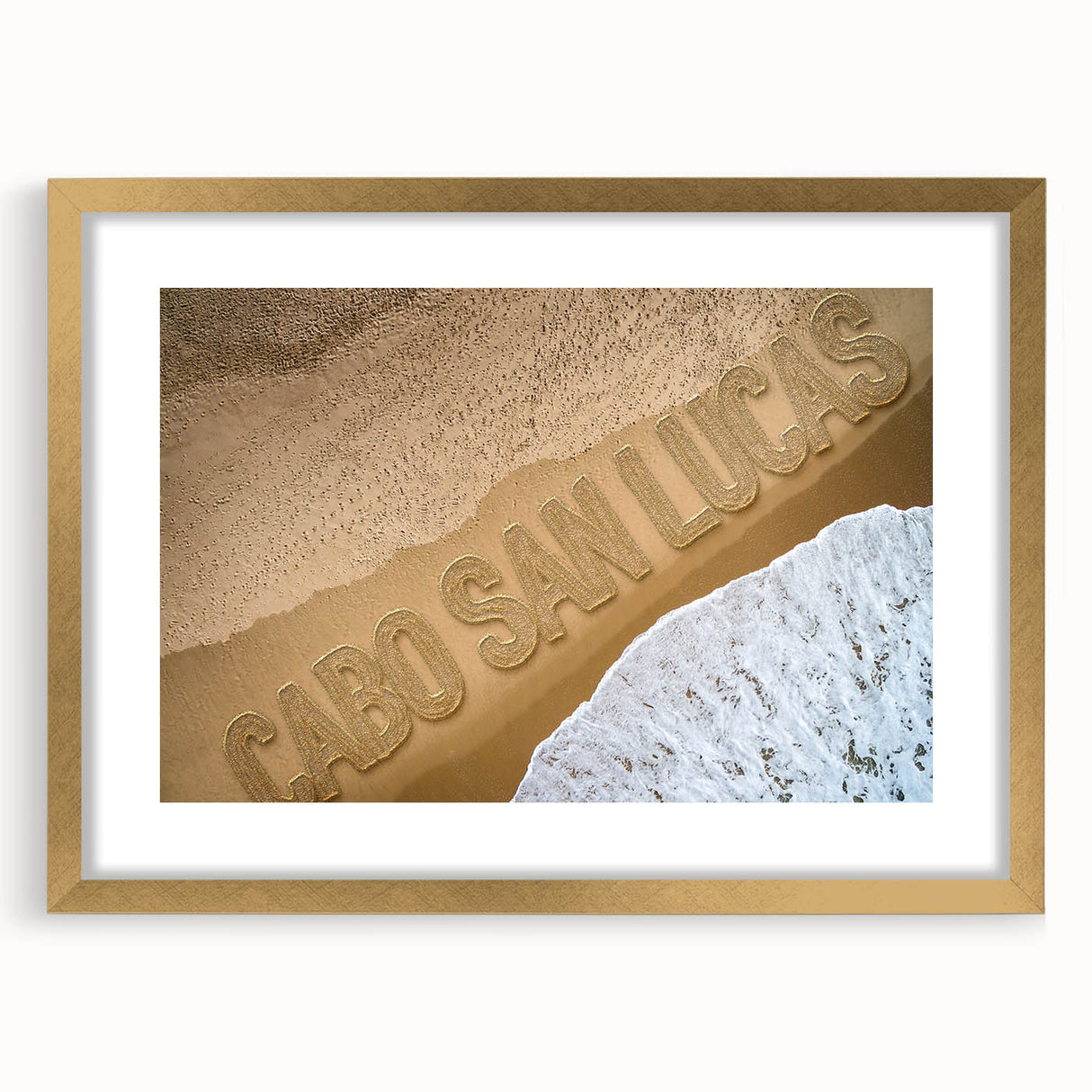 Extra large abstract art print of Cabo San Lucas scenery in gold frame, featuring textured blue and white tones.