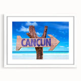 Abstract art print of Cancun scenery in muted blue and green tones, framed with a white mat.