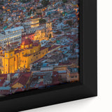 Framed canvas of Guanajuato, Mexico, featuring textured, colorful art with black outlines, ideal for living room decor.