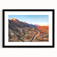 Textured abstract art print of vibrant Middle Eastern scenery on a large canvas, framed in black.