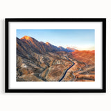 Textured abstract art print of vibrant Middle Eastern scenery on a large canvas, framed in black.