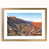 Extra large wall art depicting an abstract Middle Eastern scenery in textured gold and earth tones on a framed canvas.