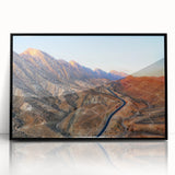 Large abstract wall art depicting a Middle Eastern scenery in muted earth tones on a framed acrylic.