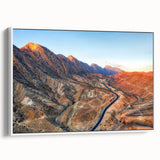 Vintage poster art of a Middle Eastern landscape on a framed canvas, blending colorful art with black accents.