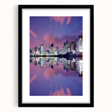Abstract art print of Tel Aviv skyline in vibrant colors on a textured, extra-large canvas, framed in black.