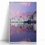 Acrylic print of Tel Aviv skyline in muted pastel shades, framed in white, suitable for modern art wall decor.