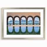 Textured abstract art print of a Middle Eastern scenery in muted earth tones, framed with a silver mat.