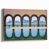 Framed canvas featuring a vintage-style landscape painting of a Middle Eastern scenery in muted earth tones.