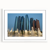 Abstract art print of Abu Dhabi skyline in muted gray tones on a framed white mat, suitable for dining room decor.
