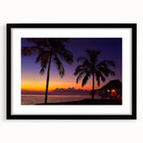 Abstract art print depicting vibrant oceanic and sunset hues on textured canvas, framed in black.