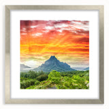 Textured art print of abstract ocean scenery in cool blue and teal tones on a silver-framed canvas, ideal for bedroom art.