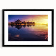 Extra large colorful art print depicting an abstract Tahitian landscape in vibrant hues on a black-framed canvas.