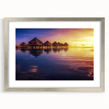 Textured art of abstract ocean waves in cool blue and teal hues, framed in silver, ideal for bedroom wall decor.