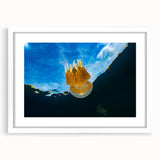 Abstract art print depicting a serene Micronesian beach with soft blue and sandy hues on a framed white mat.