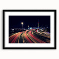 Colorful abstract art print of Auckland skyline, featuring vibrant and textured hues on a large black-framed canvas.