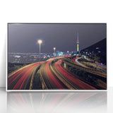 Art deco poster of Auckland skyline in muted blue and gray tones on a framed acrylic.