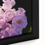 Black wall art featuring a textured, colorful abstract design on a framed canvas.