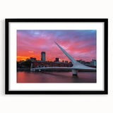 Extra large abstract art print of a colorful, textured scenery, framed in black, ideal for living room decor.