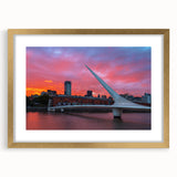 Extra large abstract art print of Buenos Aires skyline in textured gold frame, ideal for living room decor.