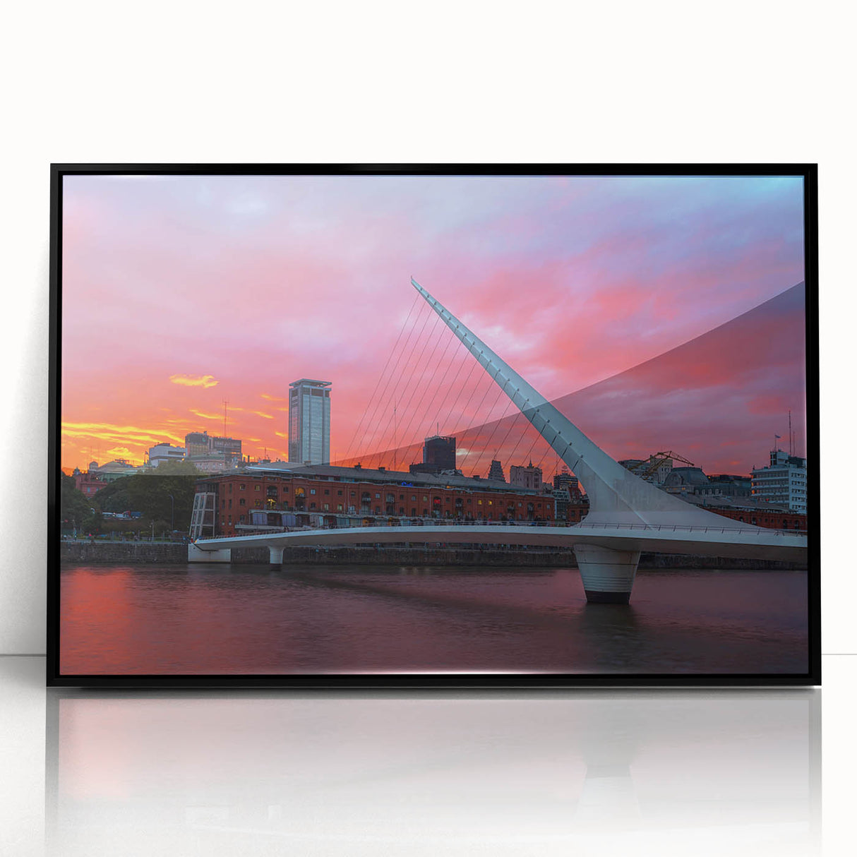 Large abstract wall art depicting Buenos Aires skyline in muted gray and blue tones, framed in black acrylic.