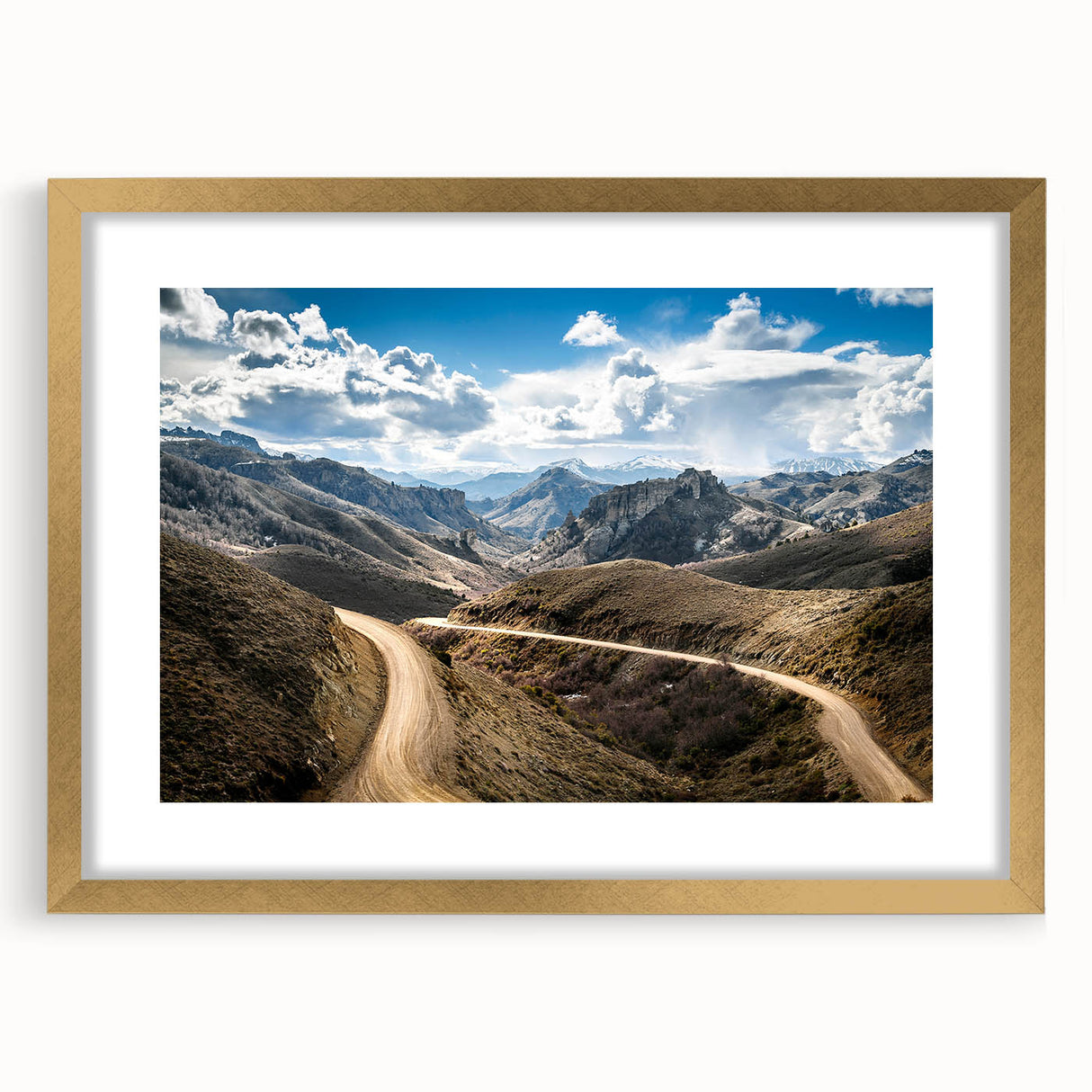 Extra large abstract art print depicting a textured South American scenery in earthy tones on a gold-framed canvas.