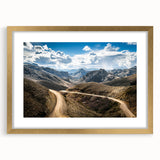 Extra large abstract art print depicting a textured South American scenery in earthy tones on a gold-framed canvas.