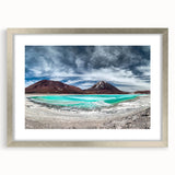 Textured abstract art print depicting a Bolivian landscape in earth tones, framed in silver, ideal for bedroom art.