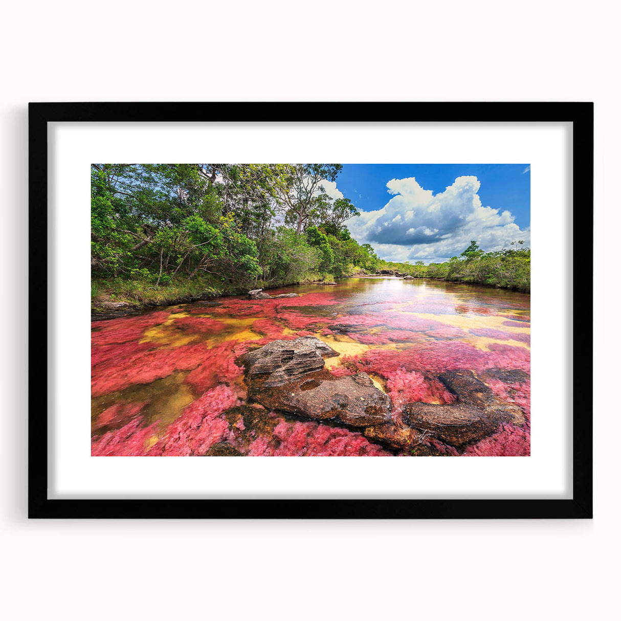 Extra large abstract art print of a vibrant, colorful Colombian landscape on a black-framed canvas.