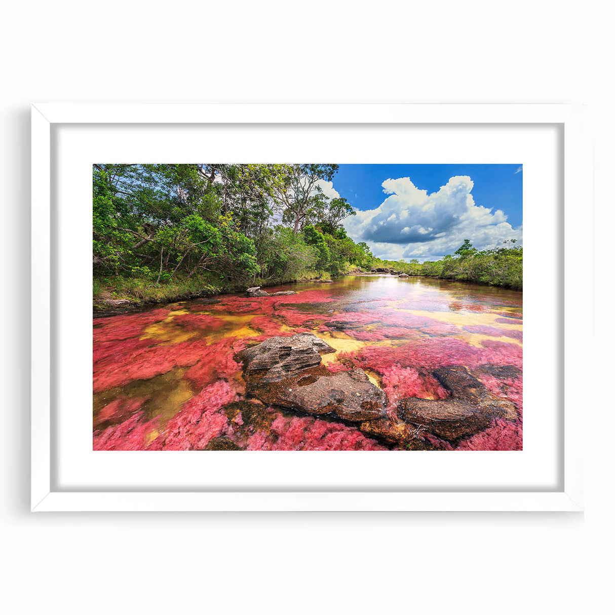 Abstract art print of a vibrant Colombian landscape in a white frame, ideal for dining room decor.