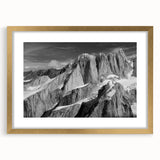 Extra large abstract art print of Denali, Alaska, in a gold frame, featuring textured brush strokes in earthy tones.