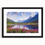 Abstract art print of Alaskan scenery in vibrant colors on a large, textured canvas, framed in black.