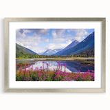 Textured art of abstract Alaskan scenery in muted gray and blue tones, framed in silver, ideal for bedroom decor.