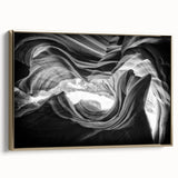Framed canvas wall art featuring a landscape of Antelope Canyon in Arizona with warm gold and black tones.
