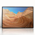 Large abstract wall art of Coyote Buttes in Arizona, featuring earth tones on a black framed acrylic.