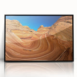 Large abstract wall art of Coyote Buttes in Arizona, featuring earth tones on a black framed acrylic.