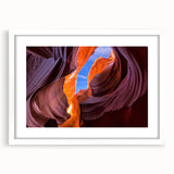 Abstract art print of the Grand Canyon in earth tones on a white-framed canvas, suitable for dining room decor.