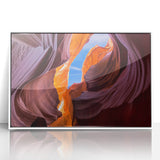 Acrylic print of the Grand Canyon in muted earth tones, framed in white, suitable for modern art wall decor.