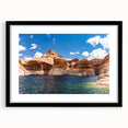Extra large, textured abstract art print of Lake Powell with vibrant blues and reds, framed with a black mat.