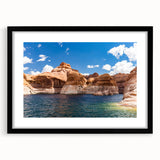 Extra large, textured abstract art print of Lake Powell with vibrant blues and reds, framed with a black mat.